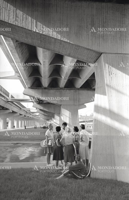 American swimmers chatting under a flyover of the Rome Olympic Village. Rome, 1960 SPECIAL FEE  - CONTACT US FOR NOT EDITORIAL USAGE