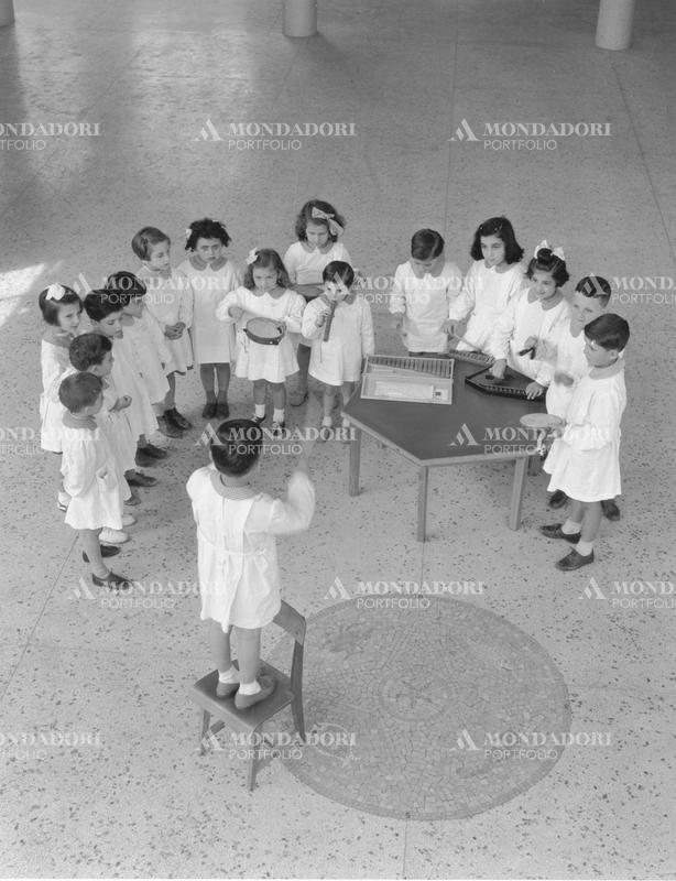 Children singing and playing music in a kindergarden. Milan, 1950s SPECIAL FEE  - CONTACT US FOR NOT EDITORIAL USAGE