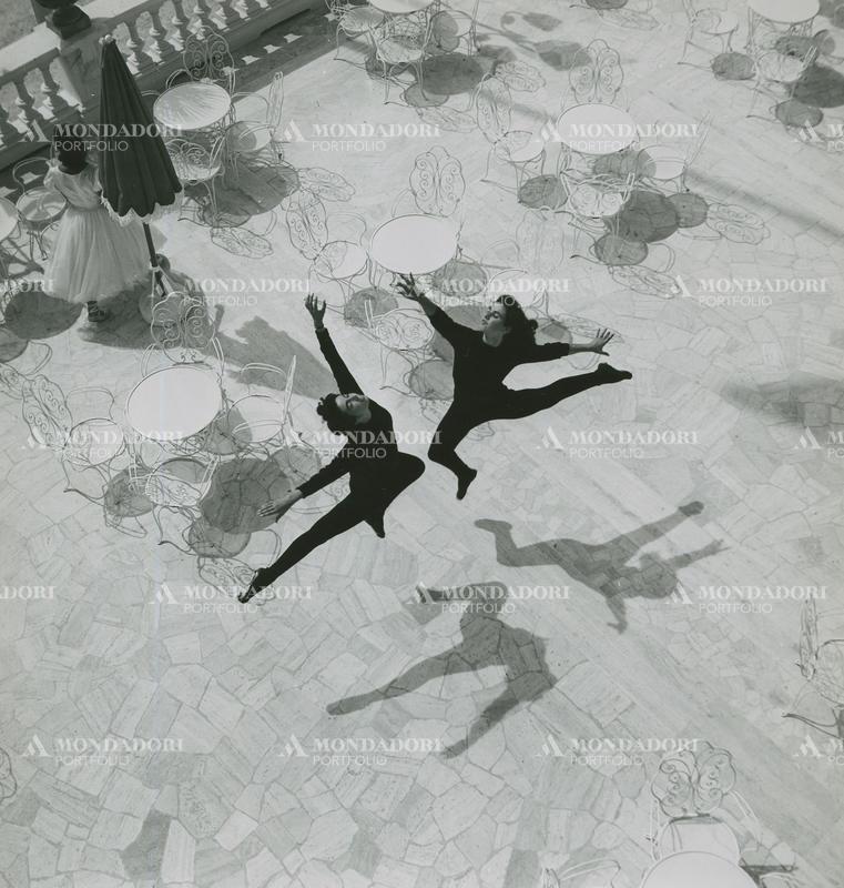 Italian dancers Anna Baroni e Wanda Conti rehearsing a choreography on the Grand Hotel Rimini terrace. Rimini, July 1953 SPECIAL FEE  - CONTACT US FOR NOT EDITORIAL USAGE