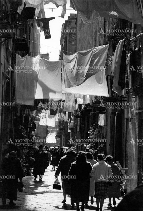 Some people walking on Via San Gregorio Armeno, the street in Naples town centre well known for the Christmas creche workshops. Naples, 1960 SPECIAL FEE  - CONTACT US FOR NOT EDITORIAL USAGE