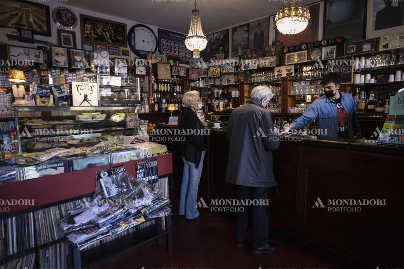 Two people have a coffee cooked from vinyls and musical objects at the Brunori Bar. Rome (Italy), March 1st, 2021