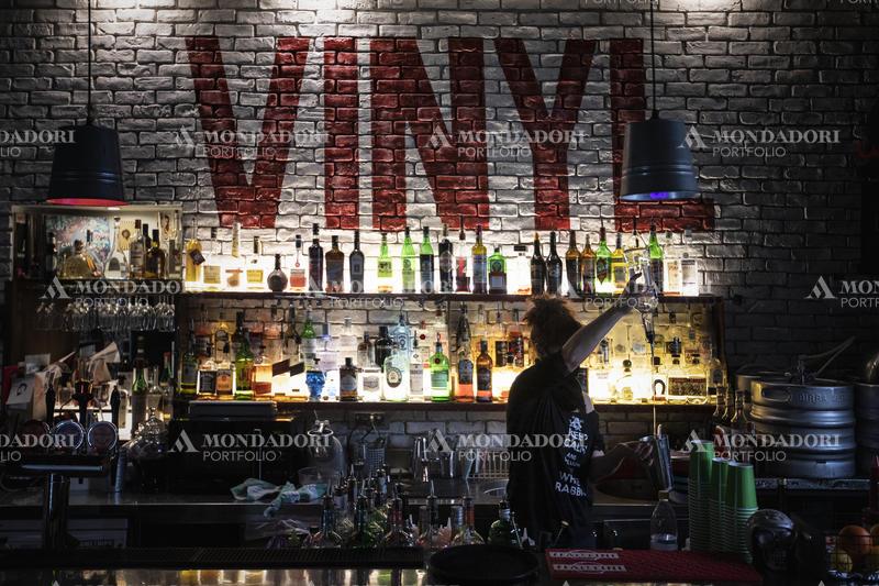 The bartender from the Vinyl Pub makes a cocktail. Milan (Italy), February 10th, 2021